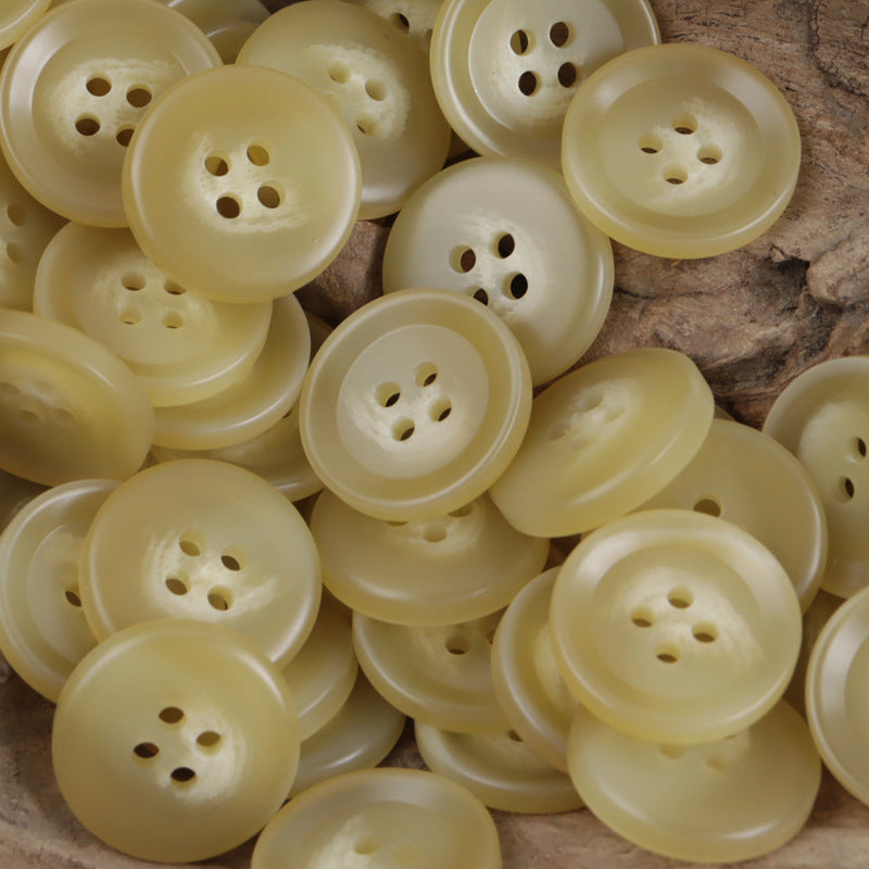 Light yellow-beige round resin buttons with 4 holes, bulk assortment