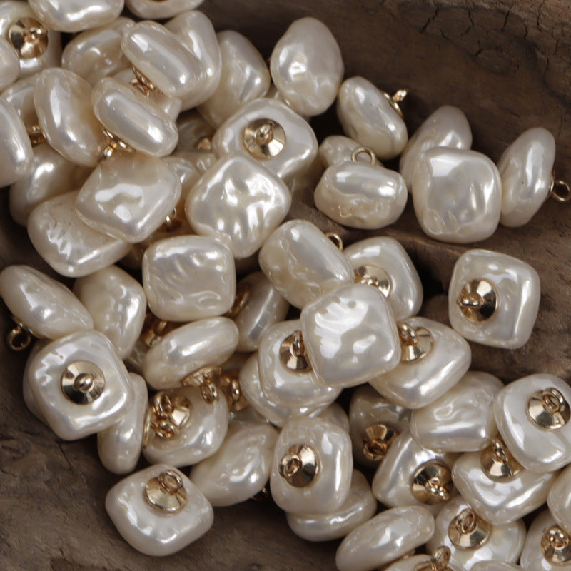 Cream/off-white square resin buttons with gold metal shanks