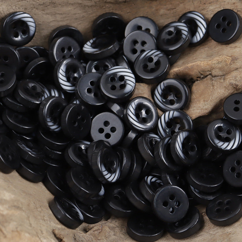 Black resin buttons with 4-hole design, arc stripe accents, 11.5mm