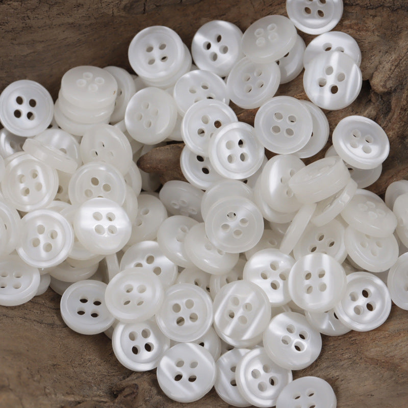 11.5mm white resin buttons, round with 4 holes for sewing
