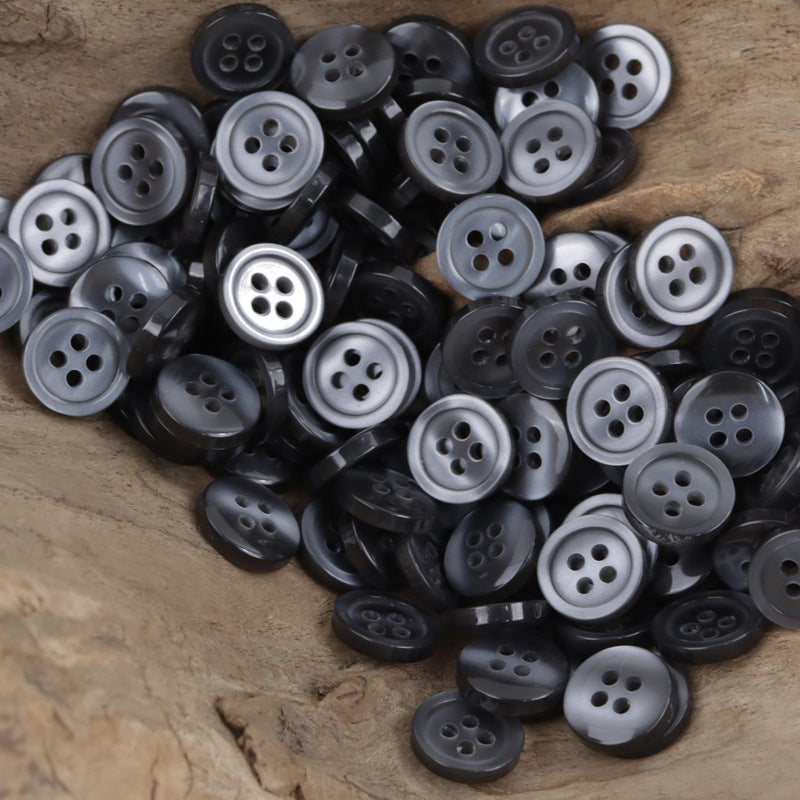 11.5mm resin buttons in black and gray, round with 4 holes for sewing