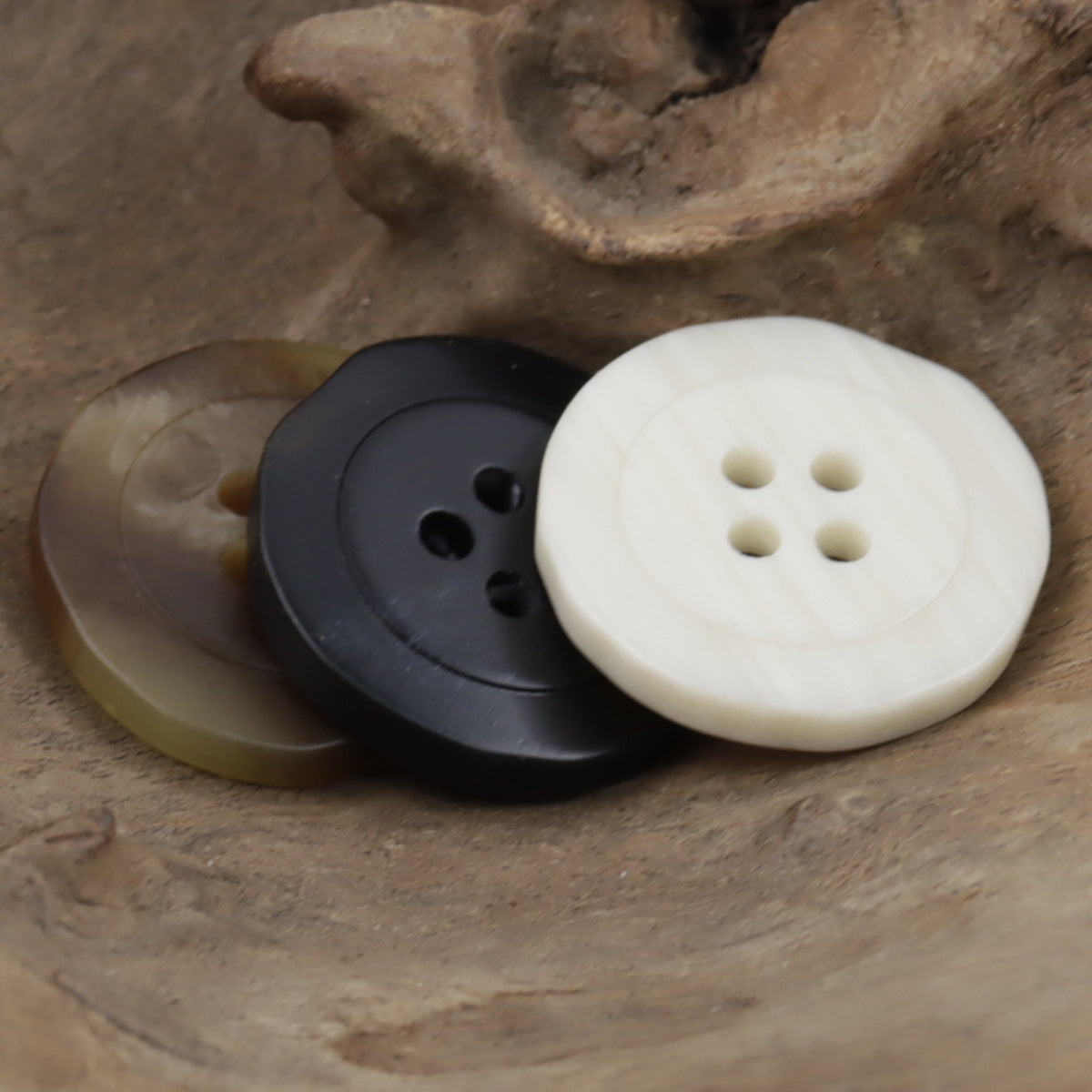 White and dark resin buttons, round four-hole, pair
