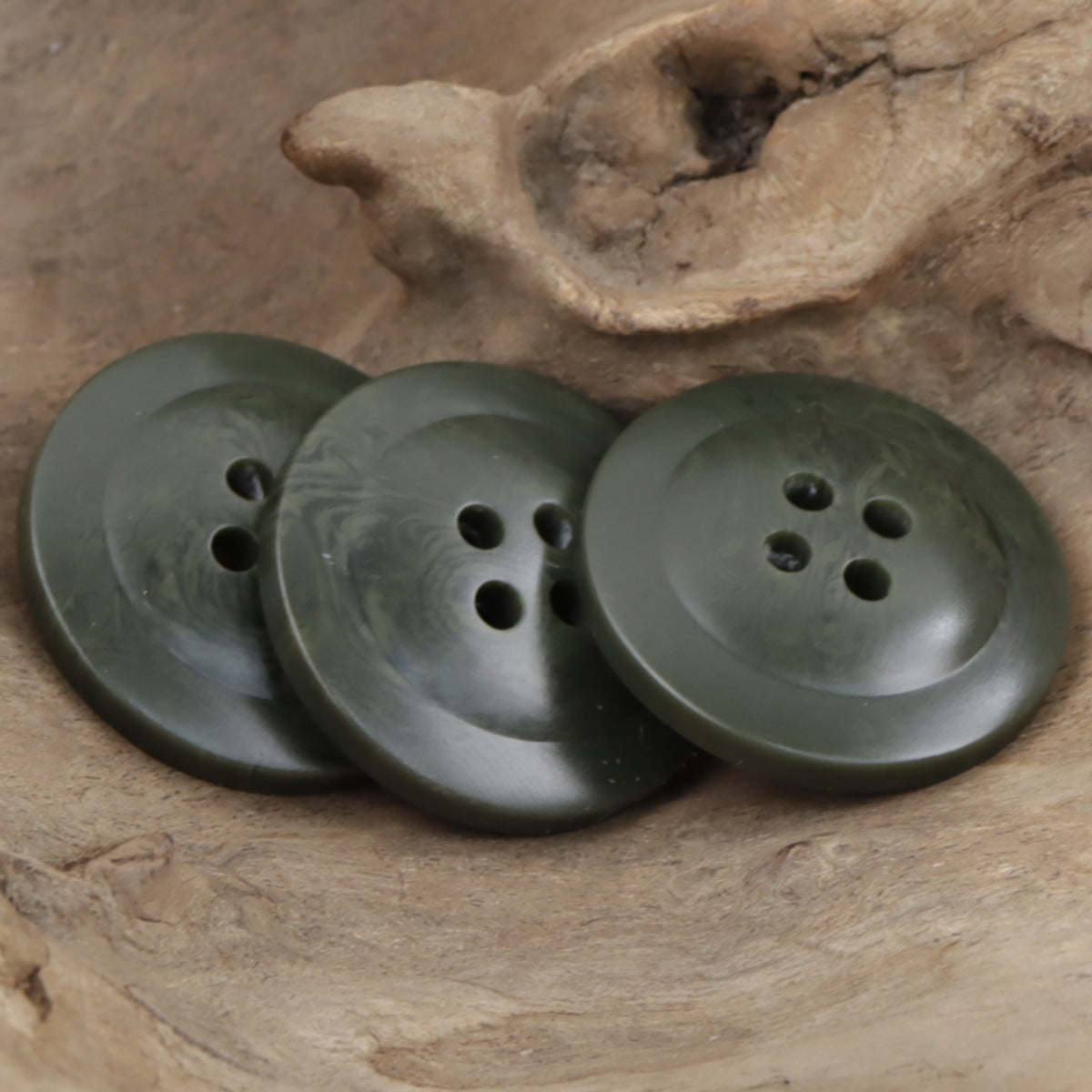 Set of dark green resin buttons, wide edge, four-hole fronts