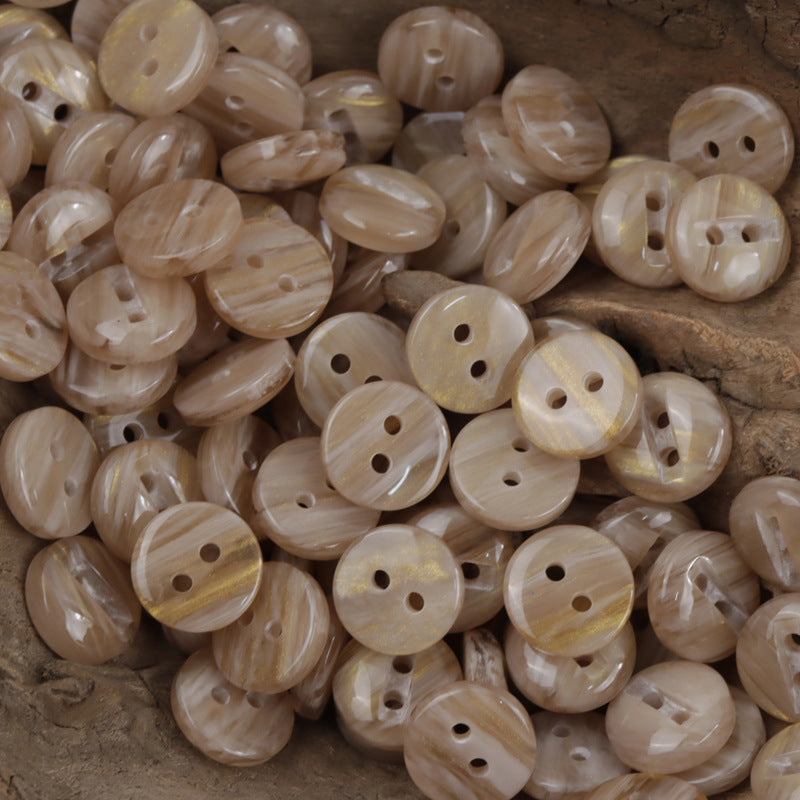 Two-hole cream/beige resin buttons, glossy round discs with two holes