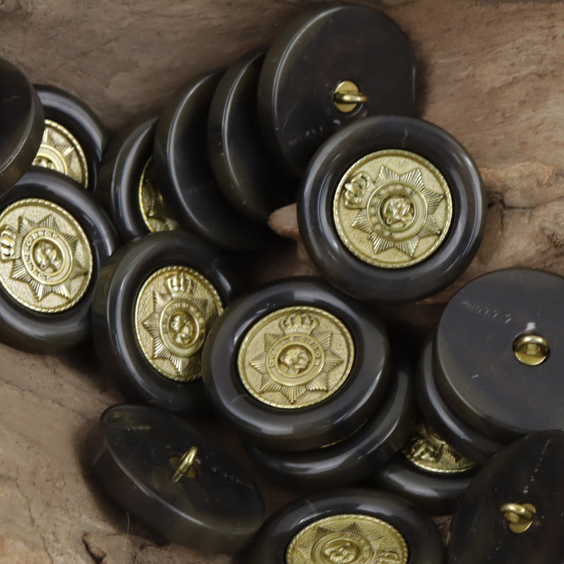 Black/charcoal resin buttons with gold star crown pattern and gold shank detail