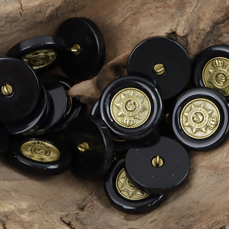 Black resin buttons with gold star crown emblem, glossy finish, gold shank detail