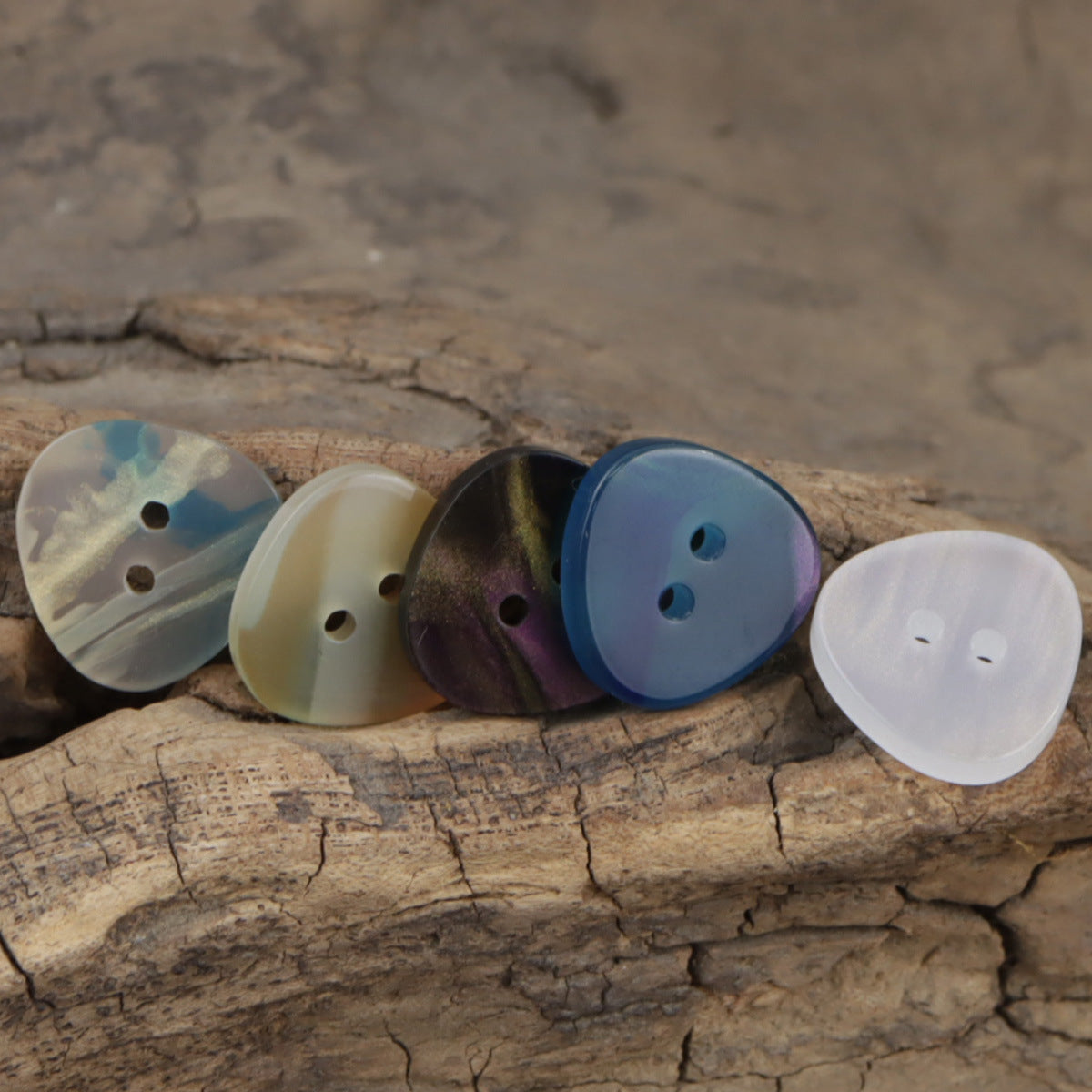 Iridescent triangle resin buttons, 2-hole in white, pale orange, purple, and blue tones