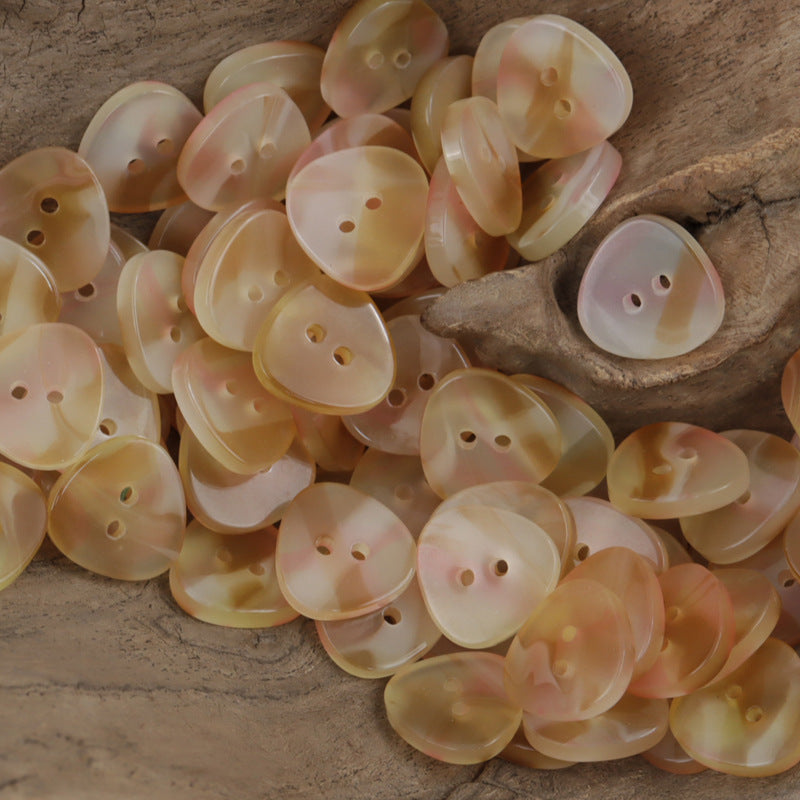 Iridescent triangle resin buttons, 2-hole in pale orange and soft peach tones