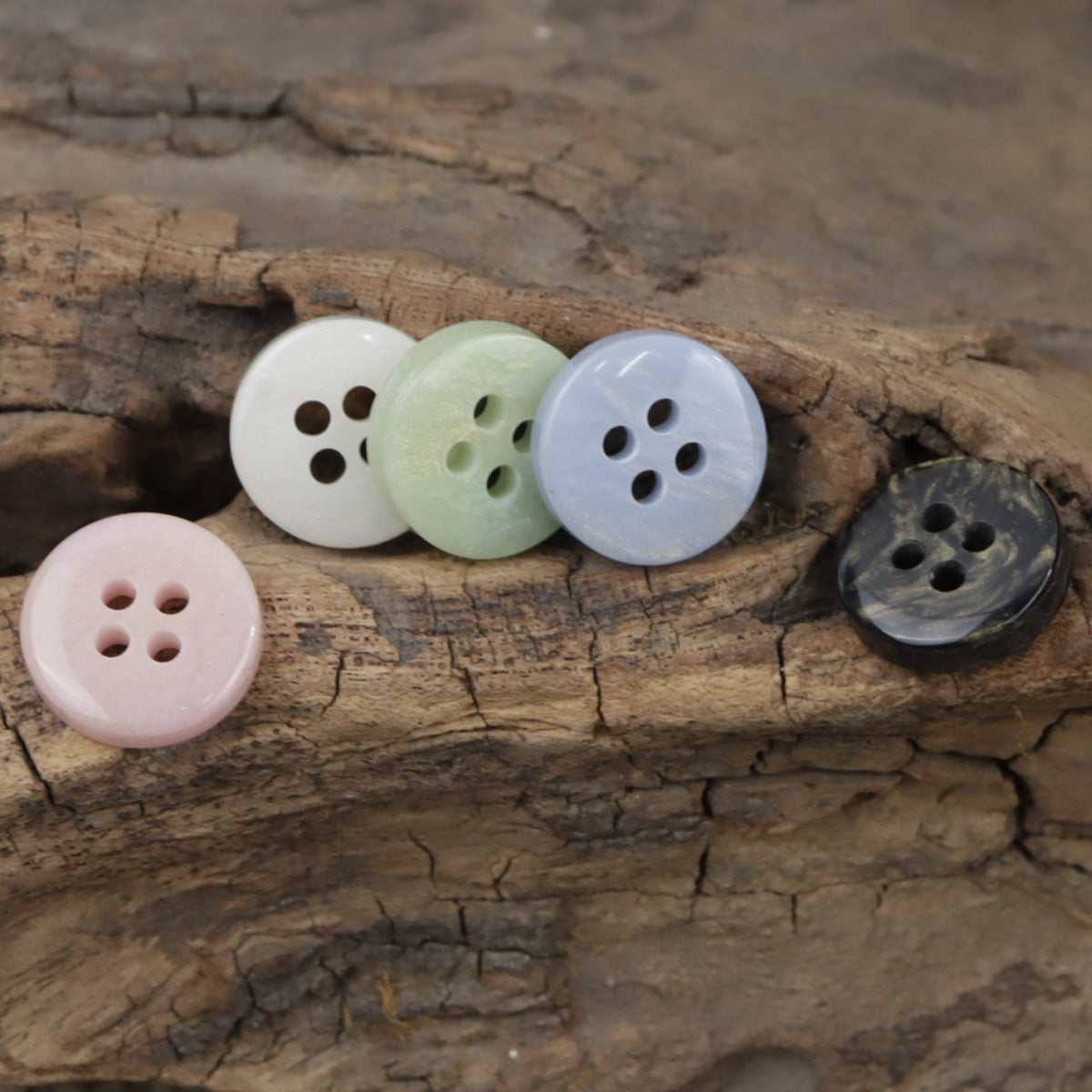 4-hole resin buttons in white, pale green, light blue, pale pink and dark (5 shown)