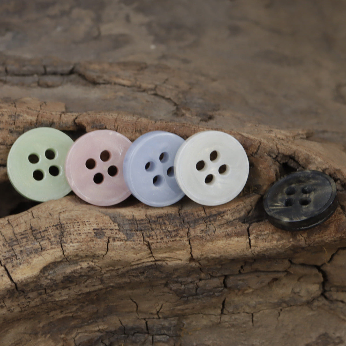 4-hole resin buttons in pale green, pink, light blue, white and dark navy (5 shown)