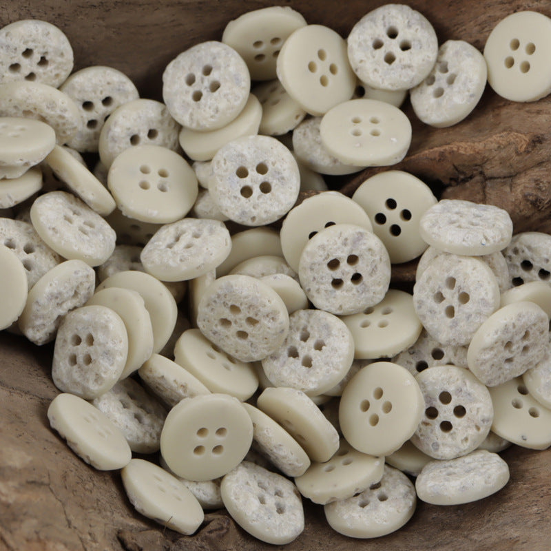 Beige and cream moon-surface resin buttons, four holes, mix of round and oval