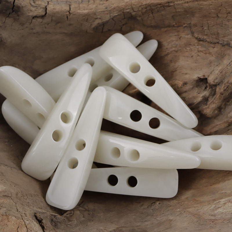 10 white long horn-pattern resin toggle buttons with different hole layouts