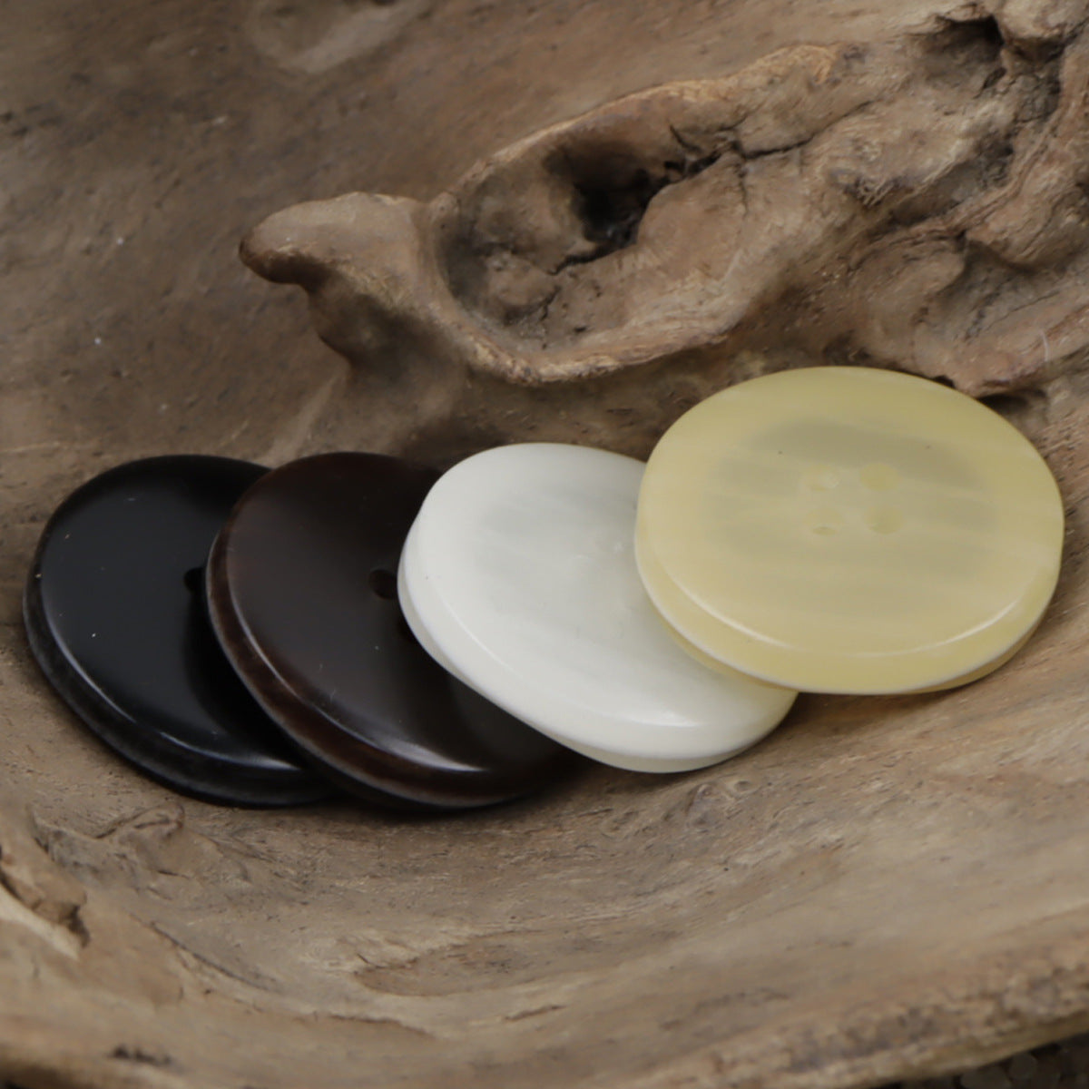 Wood-grain resin buttons, round 4-hole style in black, brown, white, and light yellow