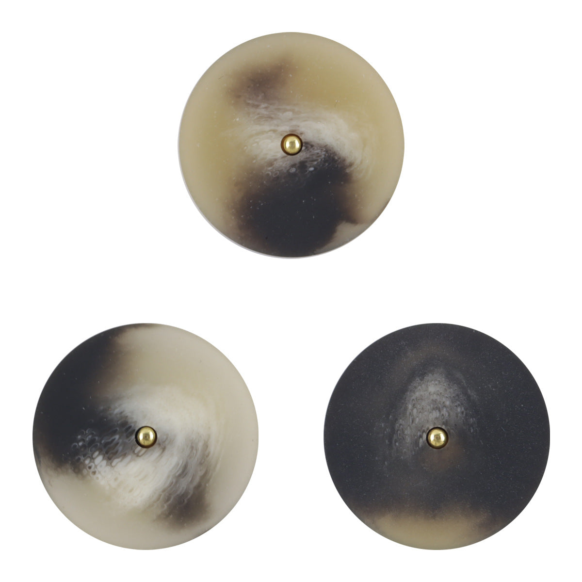 Tornado-textured resin buttons: black and beige, gold metal shank, 3 shown