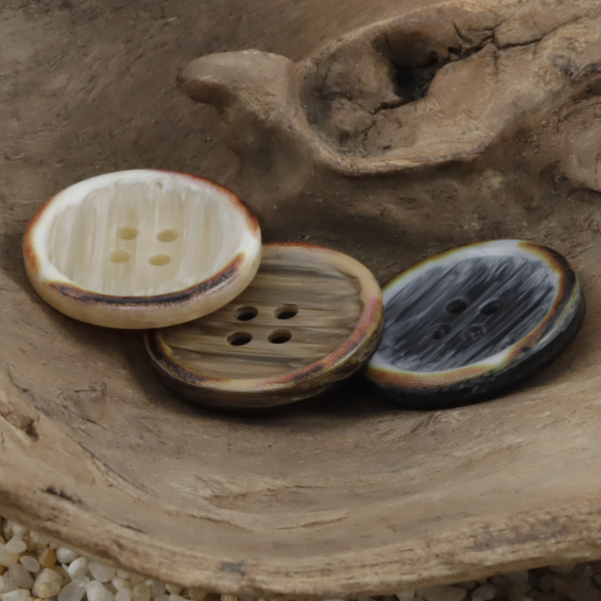 Round resin buttons, coffee-brown tones with burnt wood-grain edge, mixed hole patterns
