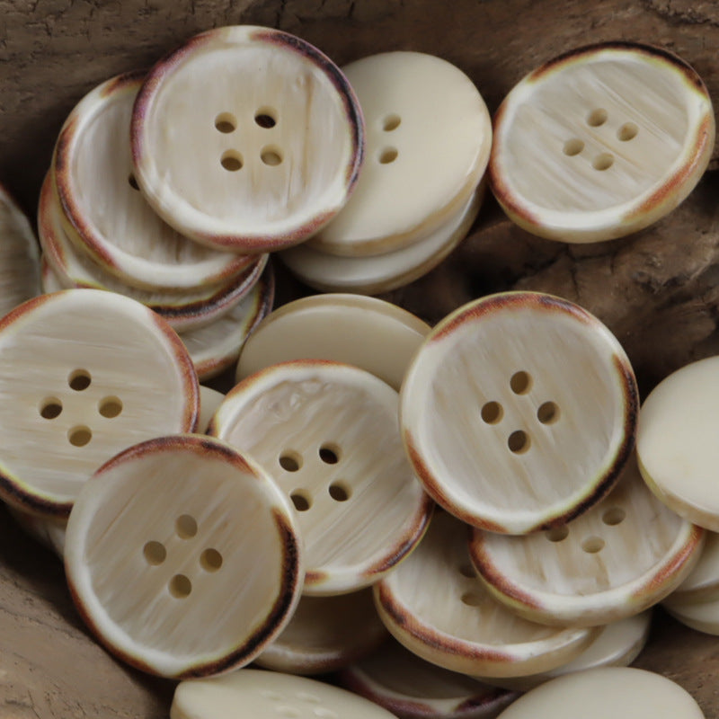 White resin buttons with burnt wood-grain edge, circular 4-hole styling, assorted pieces