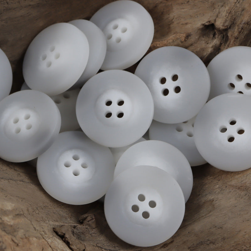 White resin buttons, round with wide rim and 4 holes (set)
