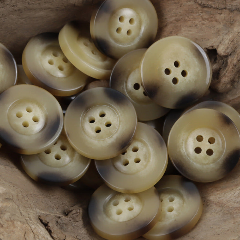 Beige and light-brown resin buttons with horn-like marbling, wide rim, 4 holes