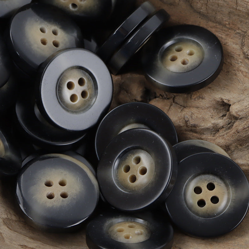 Dark resin buttons with beige centers and 4 holes, wide rim horn-style pattern