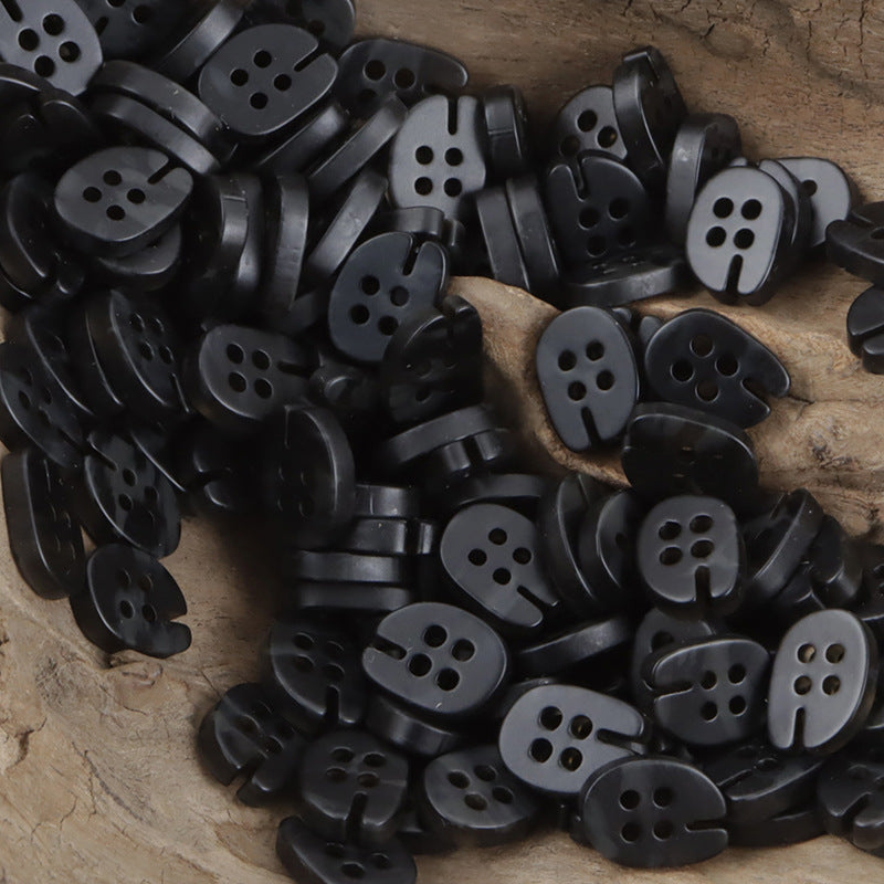 Black fish-mouth resin buttons, four-hole front, mixed batch