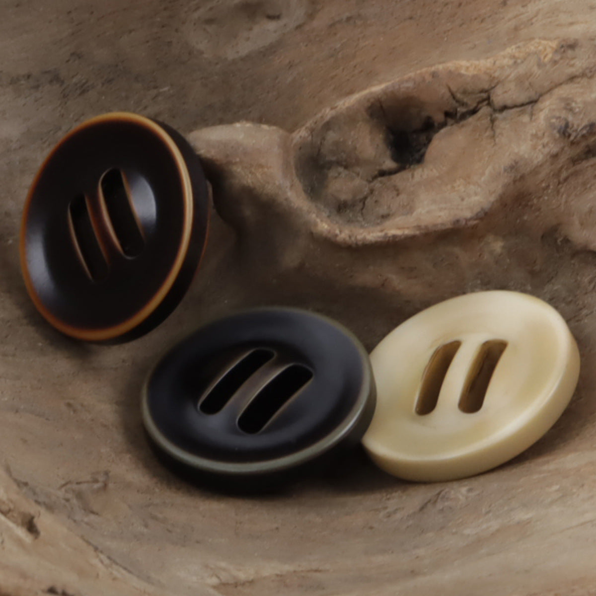 Brown and khaki long eyed three-step down resin slider buttons with 3 slots