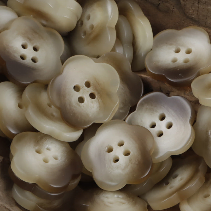 Cream and beige flower-shaped amber resin buttons, each with 4 holes