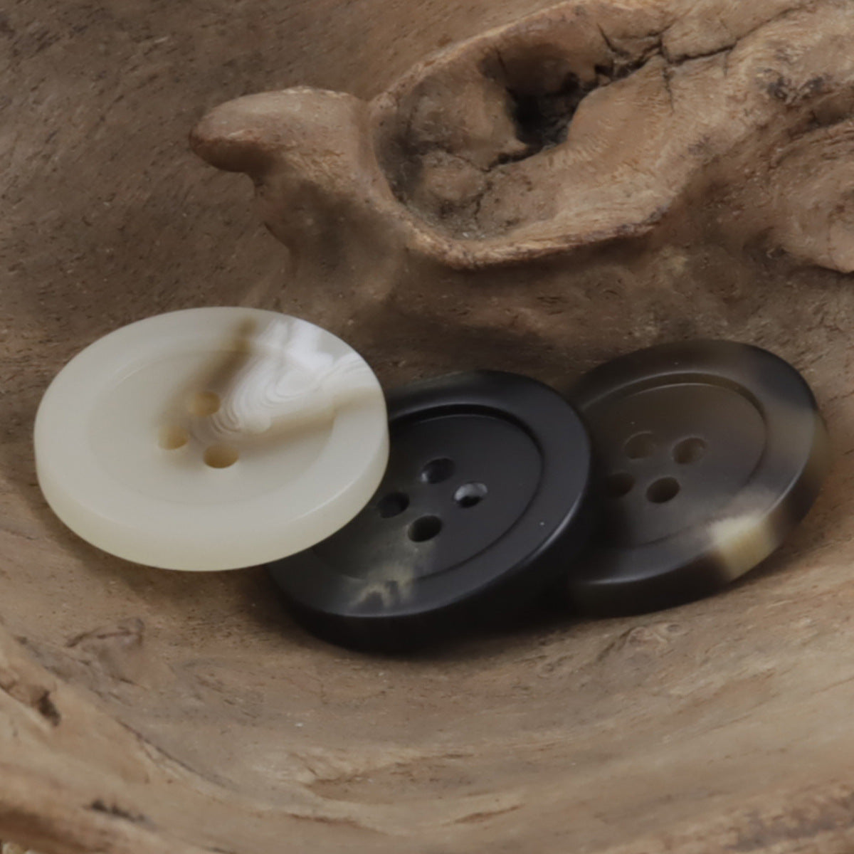 Cream and dark round 4-hole resin buttons in mixed colors