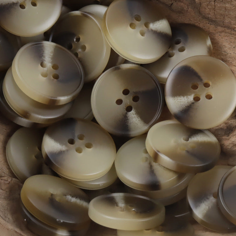 Beige round resin buttons, four-hole design, multiple buttons close together