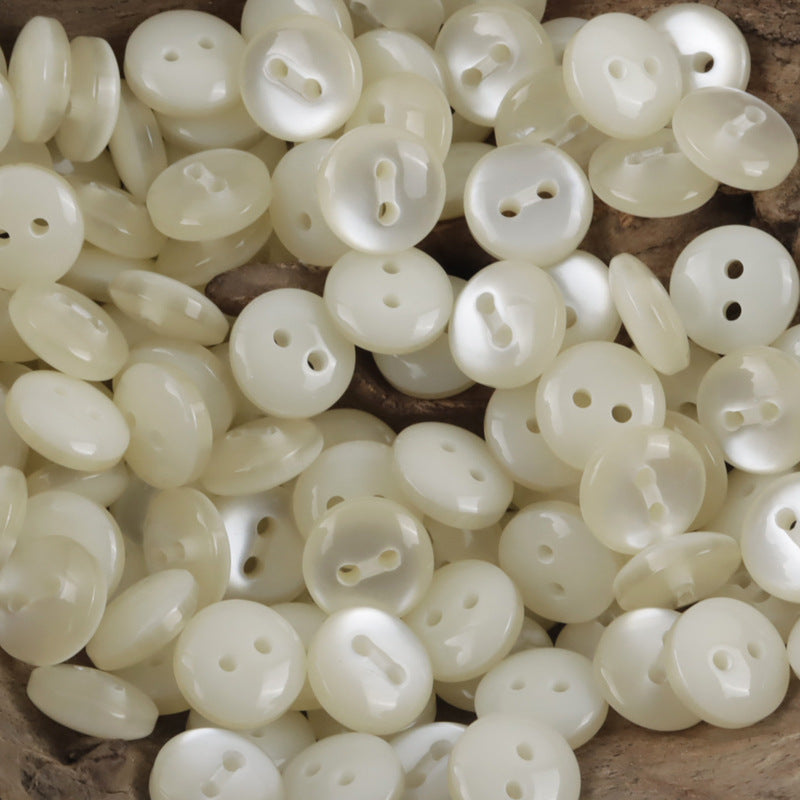 11.5mm light yellow resin buttons, round with 2 holes