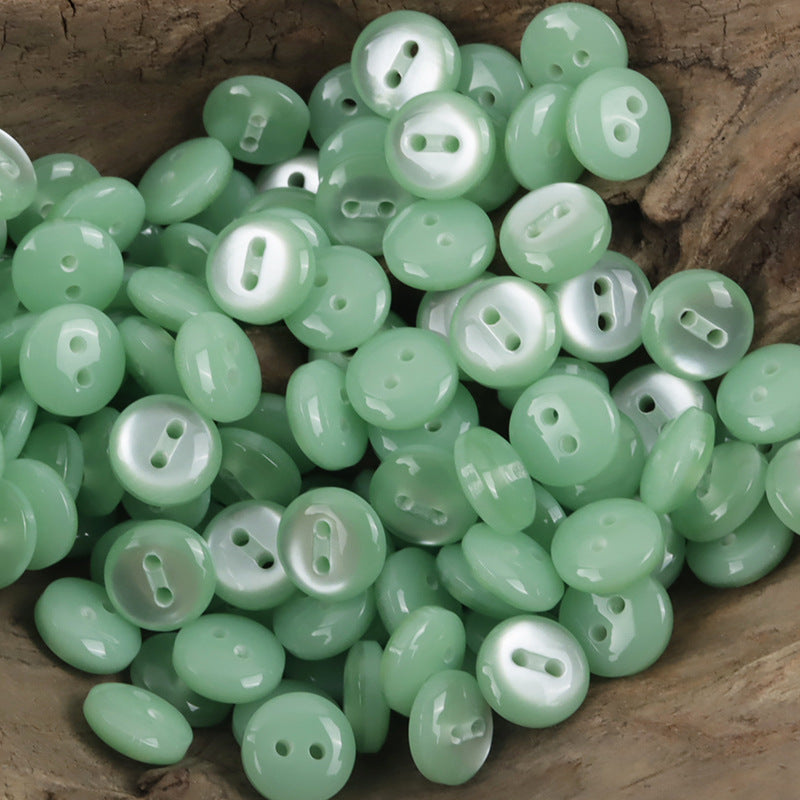 11.5mm light green resin buttons, round with 2 holes