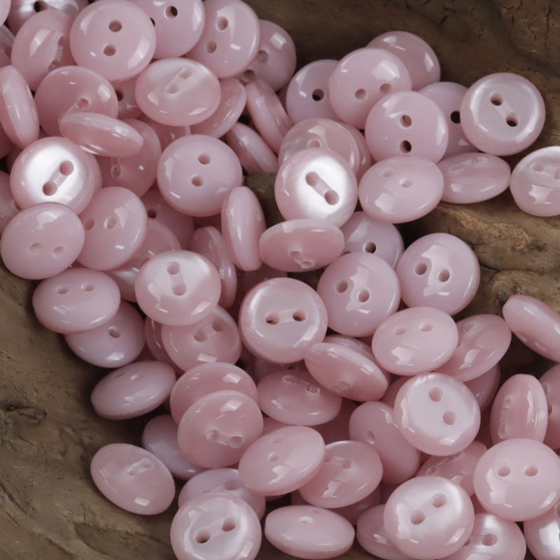 11.5mm light pink resin buttons, round with 2 holes
