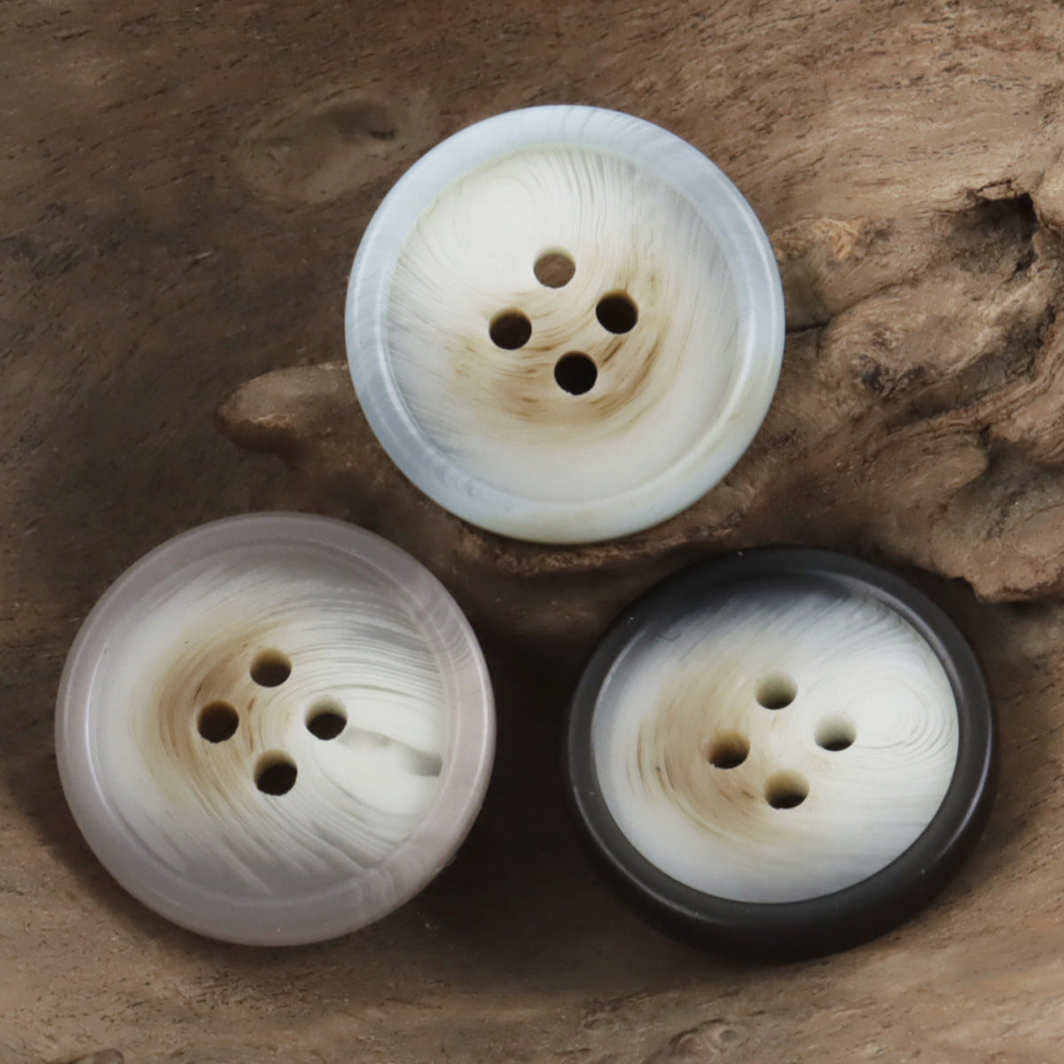Round resin buttons with 4 holes in white, light pink, and dark tones (3-pack view)