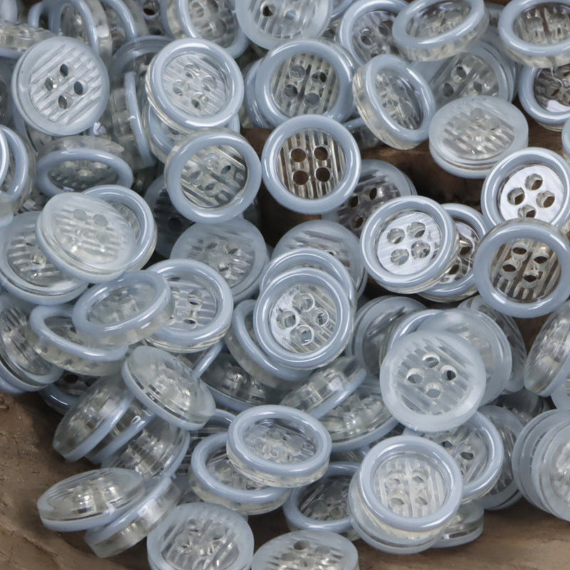 11.5mm transparent resin 4-hole buttons mixed together, mostly light gray clear centers