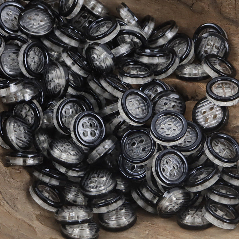 11.5mm transparent resin 4-hole buttons, many in dark/black with clear centers