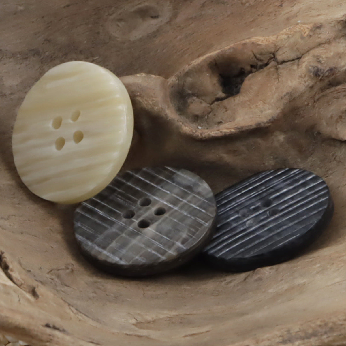 Beige, coffee, and dark striped resin buttons, flat beveled, each with 4 holes