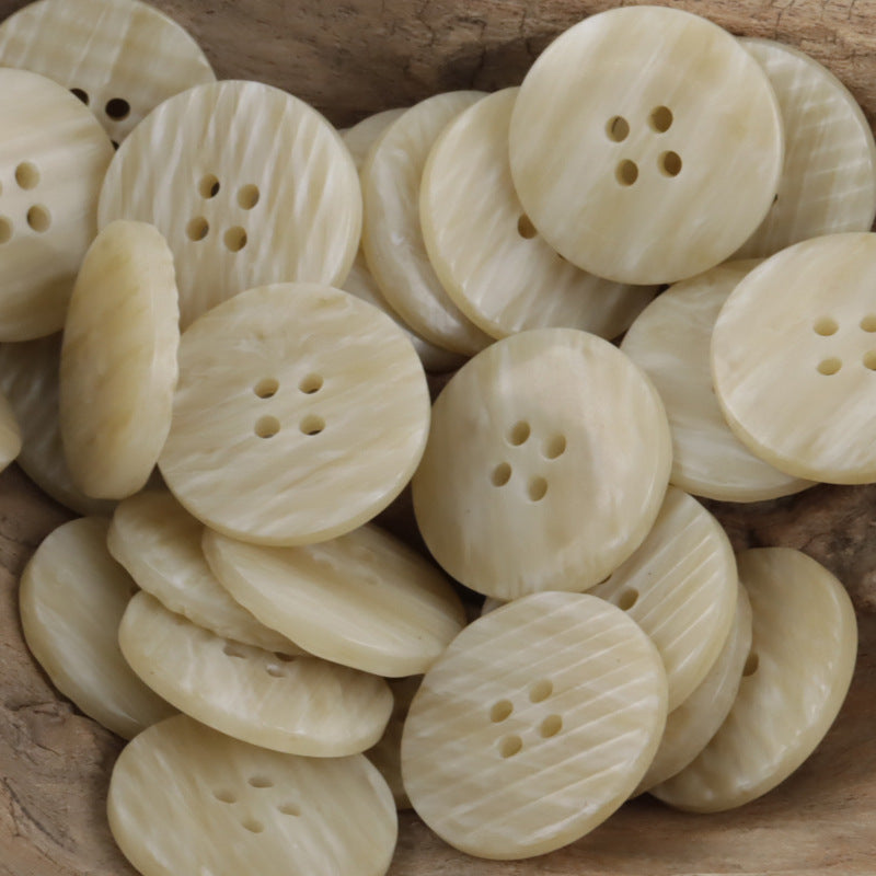 Beige flat resin buttons with irregular woodgrain texture, 4-hole front