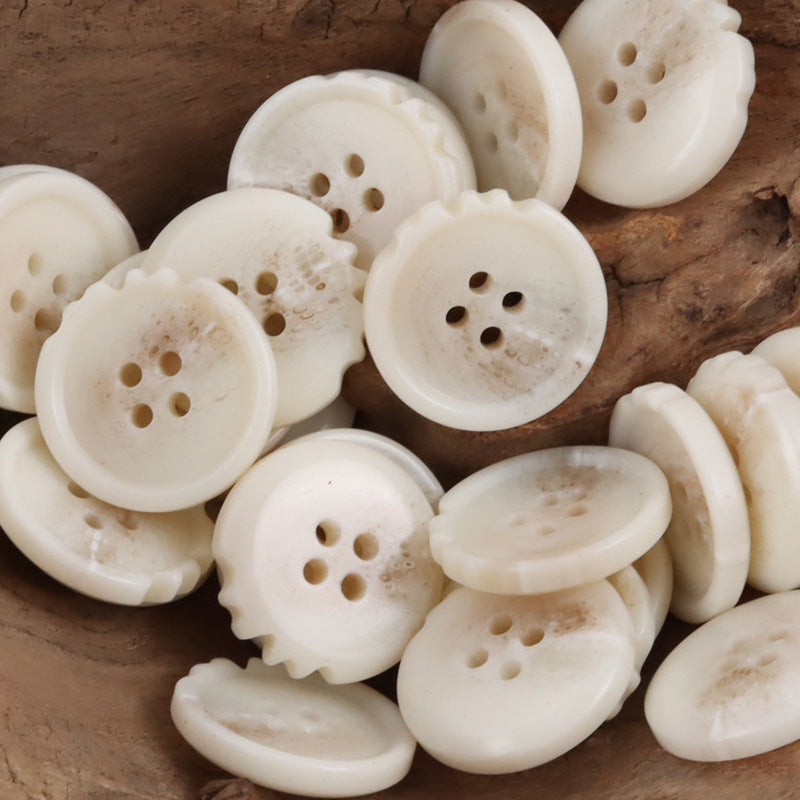 Beige chipped resin buttons, round with ridged edges and 4 holes (assorted pieces)