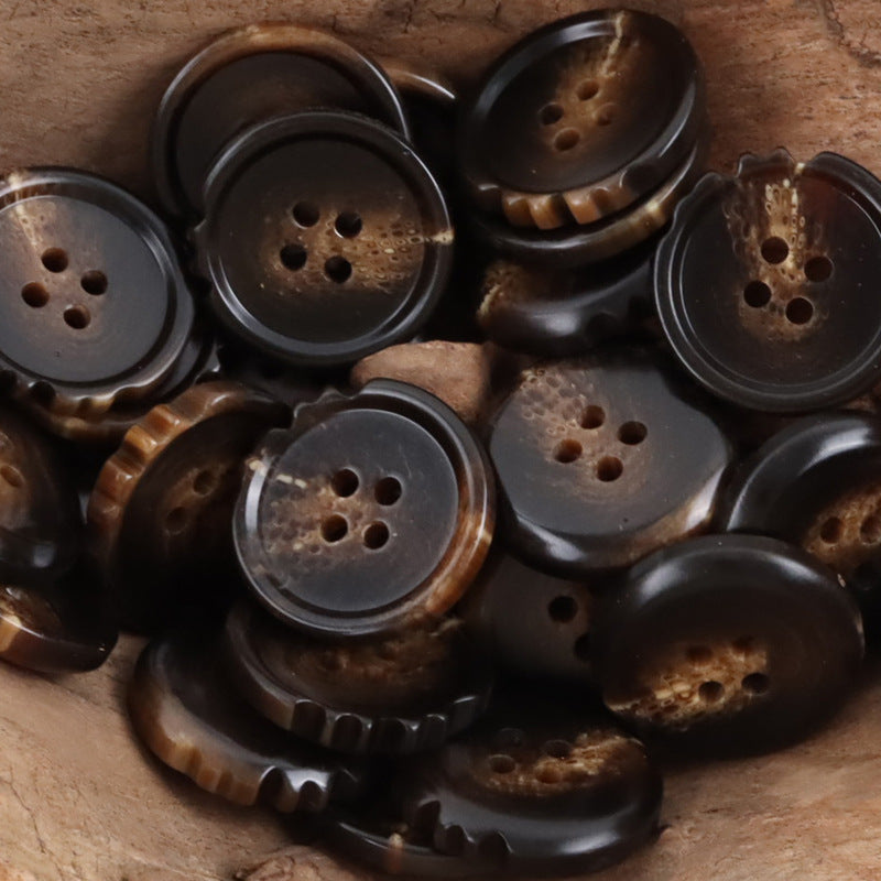 Coffee and dark resin buttons with ridged edges and 4 holes, chipping detail