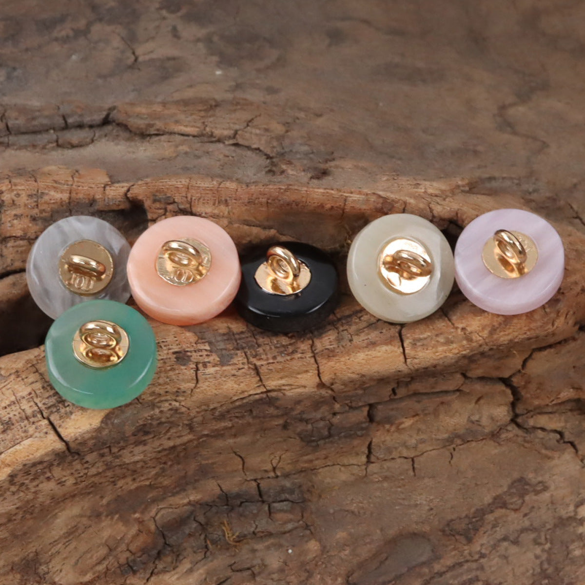 Assorted round resin shank buttons in pale beige, pink, black, light green, lavender