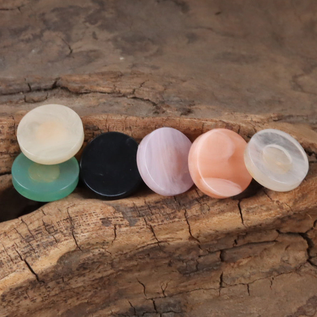 Round resin shank buttons in white, black, lavender, peach and pale green