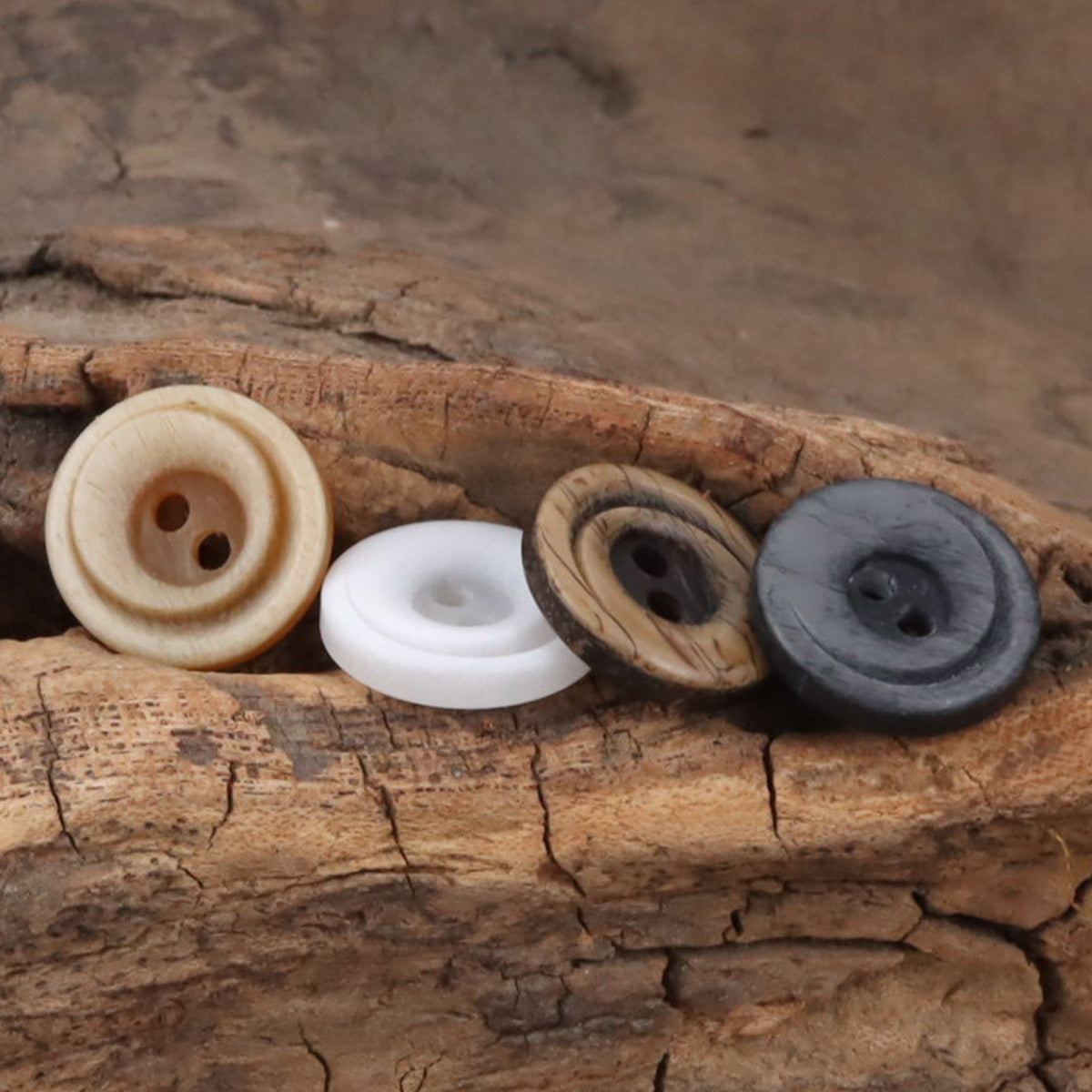 Cream to charcoal 2-hole resin gradient crescent buttons with swirling edges