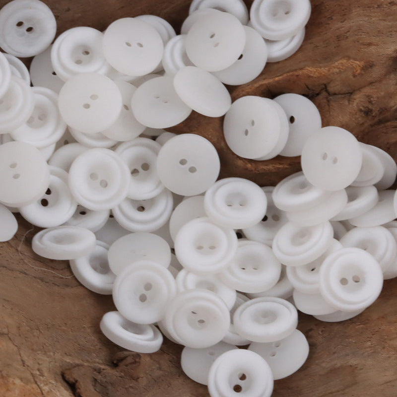 White 2-hole resin gradient crescent buttons, round with smooth front face