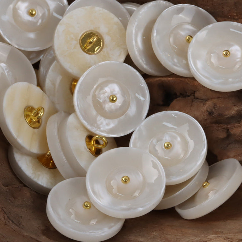 Round resin curtain buttons in beige yellow/cream with gold metal shanks