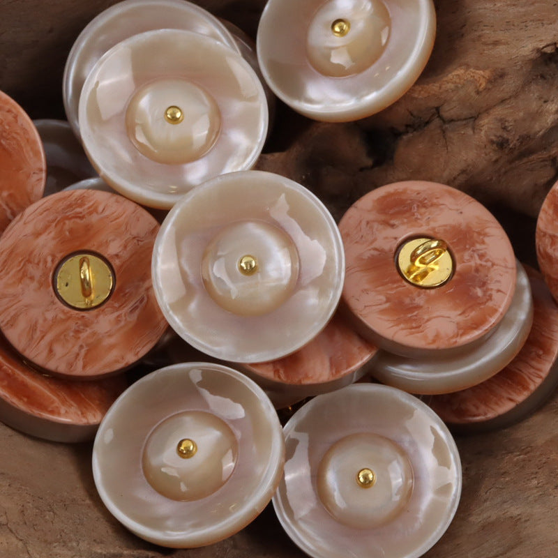 Round resin curtain buttons in cream and beige yellow with gold metal shanks