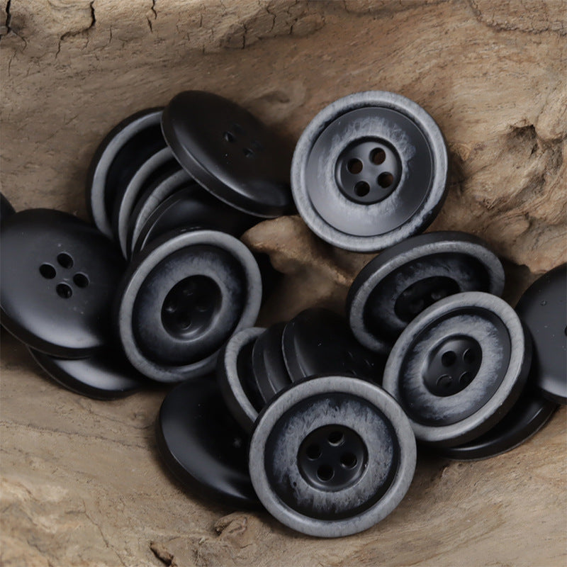 Set of dark resin buttons with light gray outer ring and 4 holes, assorted view