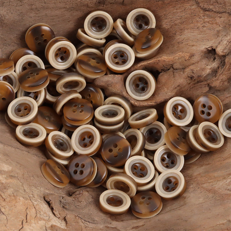 Two-tone resin button pile, 4-hole, amber rings with darker centers