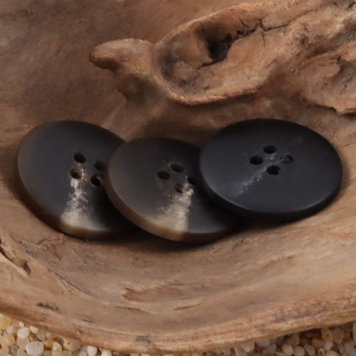 Round 4-hole vintage resin buttons in dark coffee and black tones, matte finish