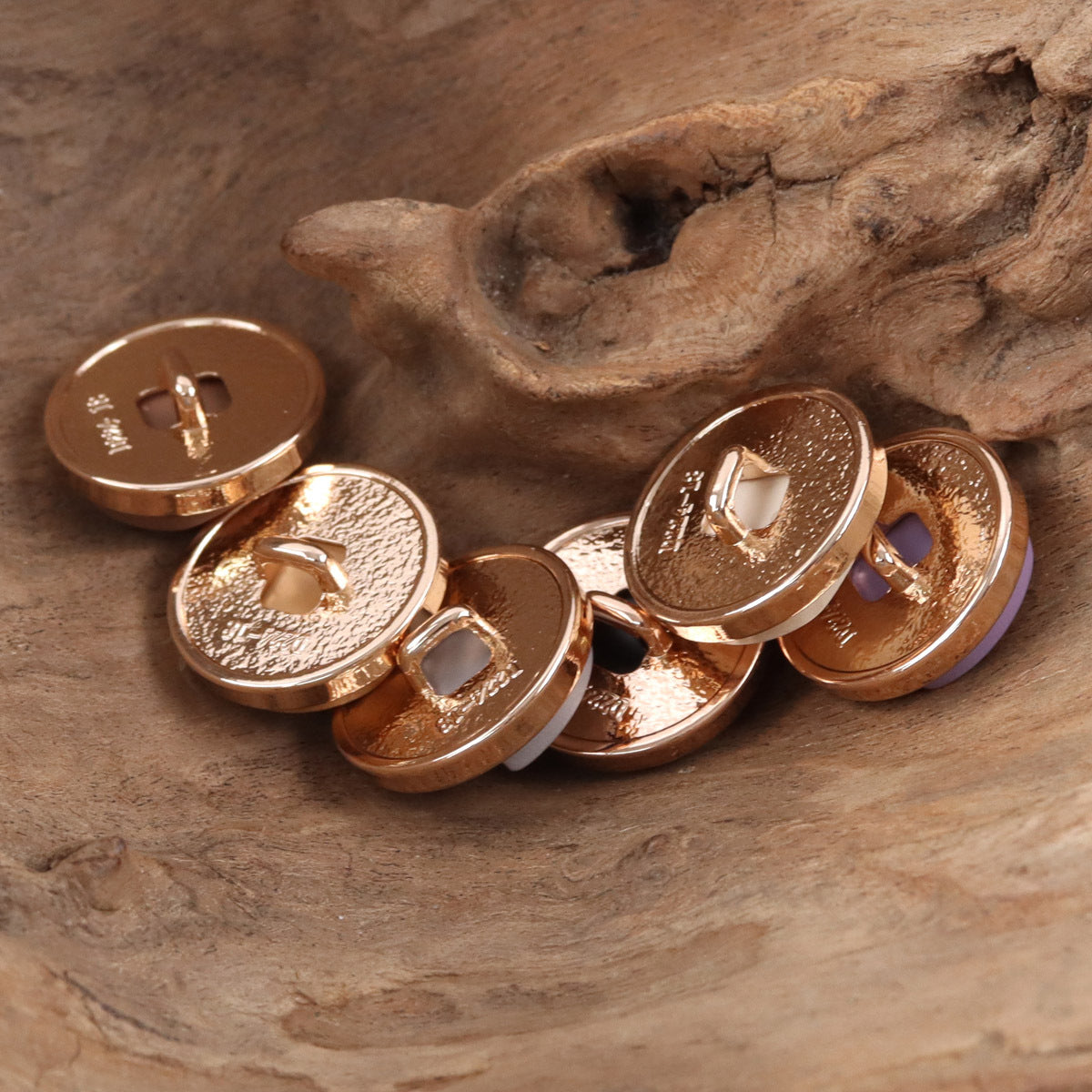 Amber-brown round geometric resin metal buttons with rose-gold rims
