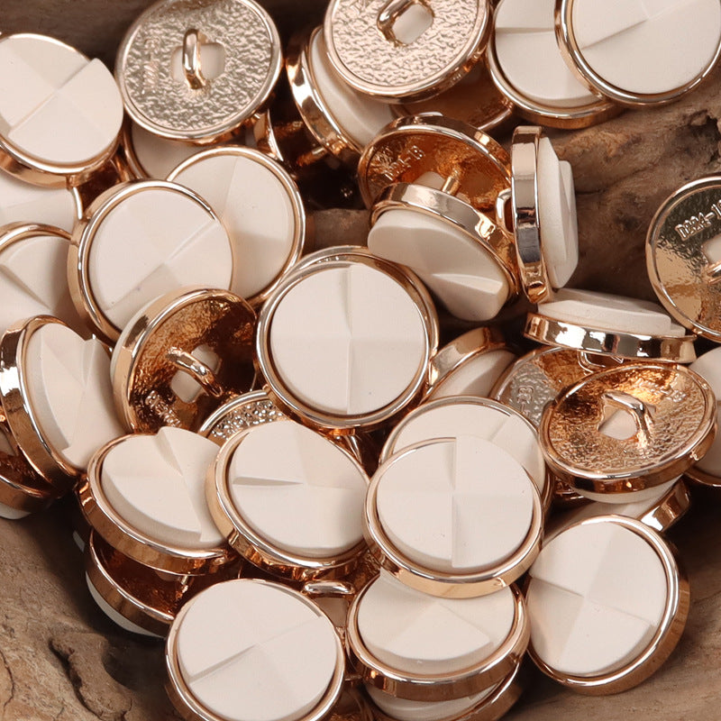 Cream/white round geometric resin metal buttons with gold-tone rims