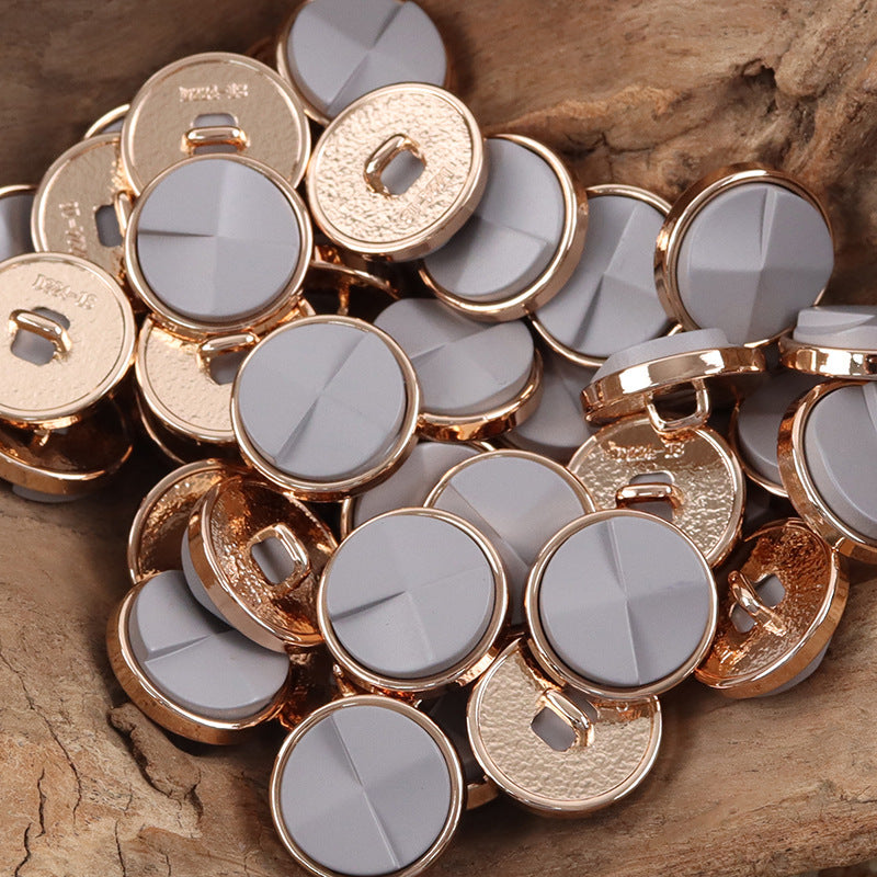 Light gray and cream round geometric resin metal buttons with rose-gold rims
